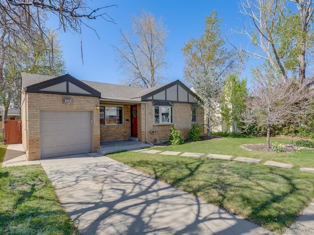 view of front of property featuring brick siding, fence, a front lawn, concrete driveway, and an attached garage