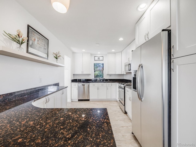 kitchen with open shelves, a sink, white cabinets, stainless steel appliances, and recessed lighting