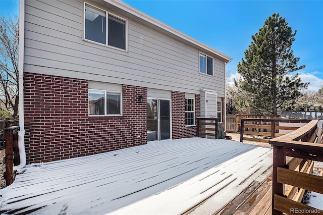 wooden terrace featuring fence