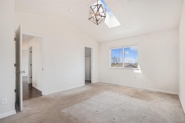 2791 S Bahama Ct, Aurora, CO 80013 - unfurnished bedroom featuring carpet, vaulted ceiling, a skylight, and baseboards