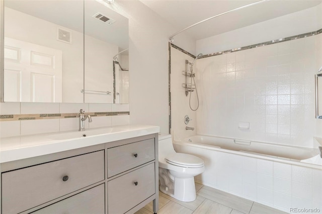 bathroom featuring toilet, tasteful backsplash, bathtub / shower combination, and visible vents