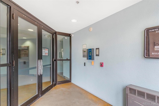 interior space featuring finished concrete floors and french doors