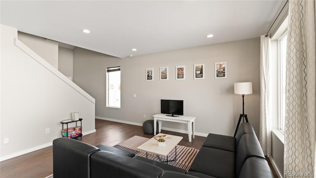 living room featuring plenty of natural light, recessed lighting, and dark wood-type flooring