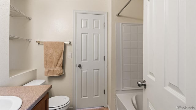 bathroom with vanity, toilet, and shower / bathtub combination