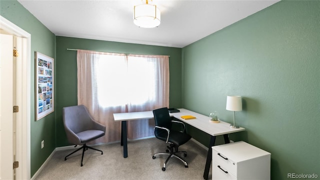 home office featuring baseboards and carpet floors