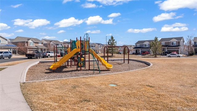 communal playground featuring a residential view