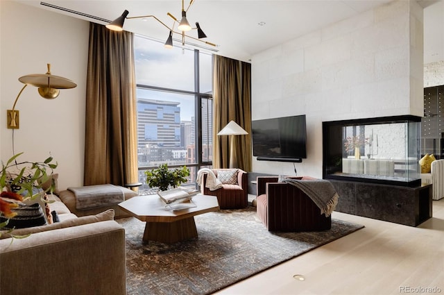 living room with floor to ceiling windows and hardwood / wood-style floors