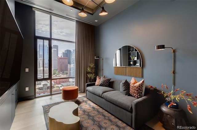 living room featuring floor to ceiling windows