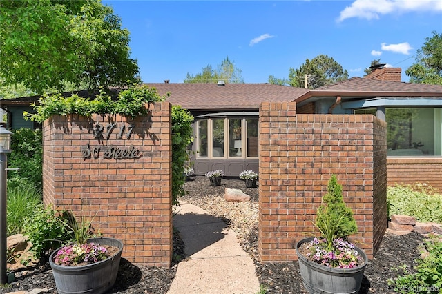 view of front of home with roof with shingles