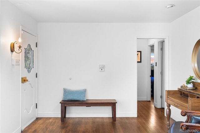 foyer entrance featuring wood finished floors and baseboards