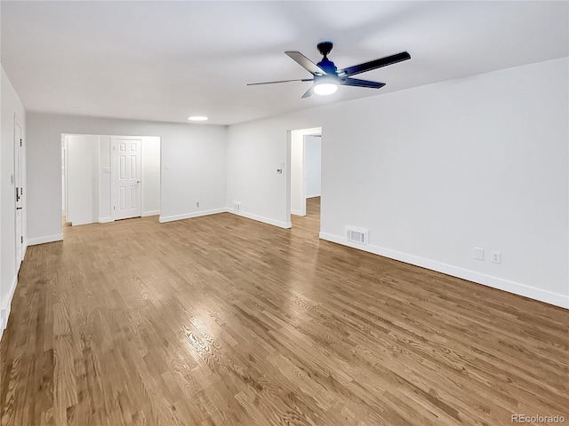 empty room featuring light wood-type flooring and ceiling fan