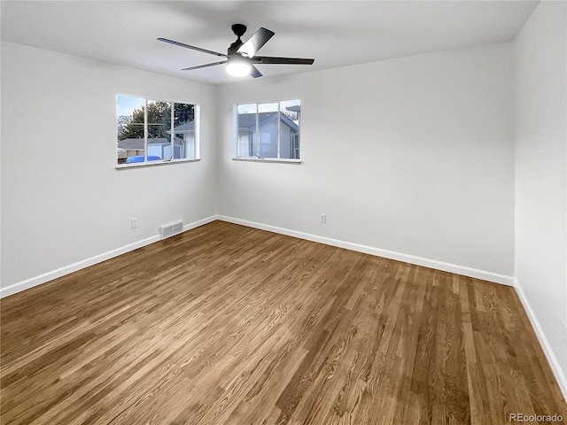 spare room featuring ceiling fan and hardwood / wood-style flooring