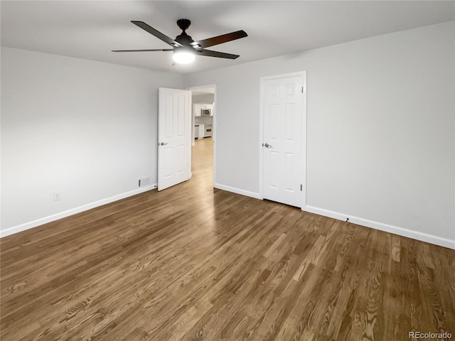 unfurnished bedroom featuring hardwood / wood-style floors and ceiling fan