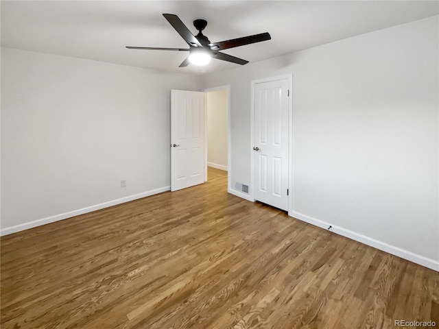 unfurnished bedroom with hardwood / wood-style flooring and ceiling fan