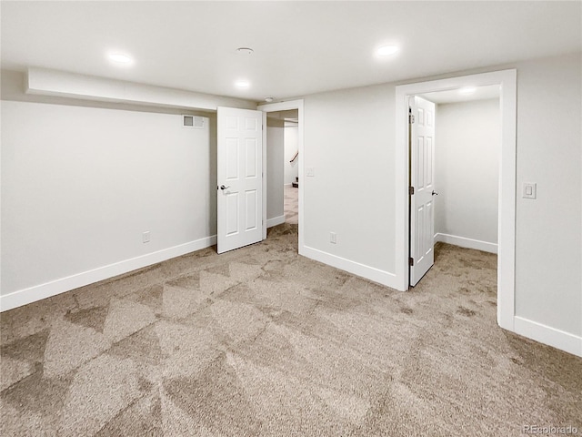 basement with light colored carpet