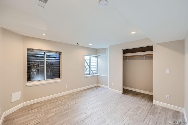 unfurnished bedroom featuring recessed lighting, baseboards, visible vents, and light wood finished floors