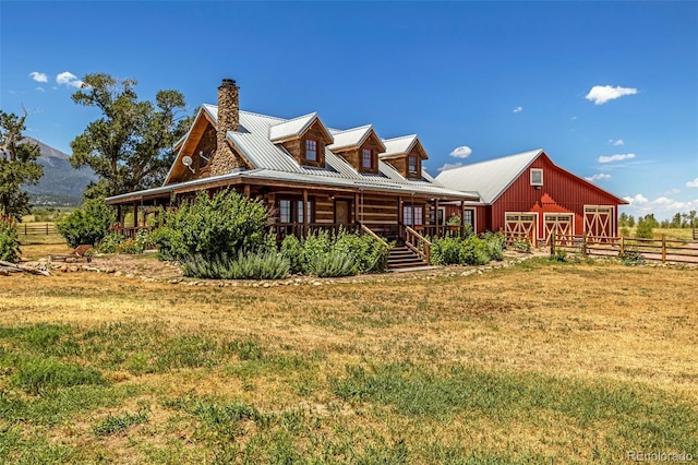 view of property exterior featuring a yard and a rural view