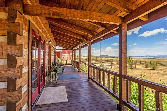 wooden deck featuring a rural view