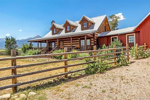 log cabin with a mountain view