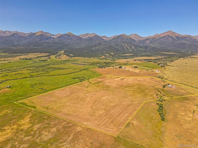 drone / aerial view featuring a mountain view and a rural view