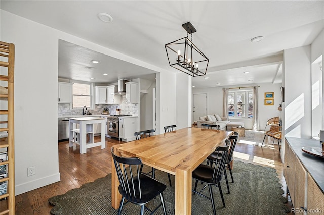 dining space with recessed lighting, dark wood-style flooring, and a healthy amount of sunlight