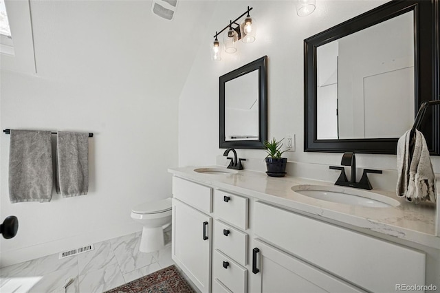 full bathroom with double vanity, visible vents, a sink, and toilet