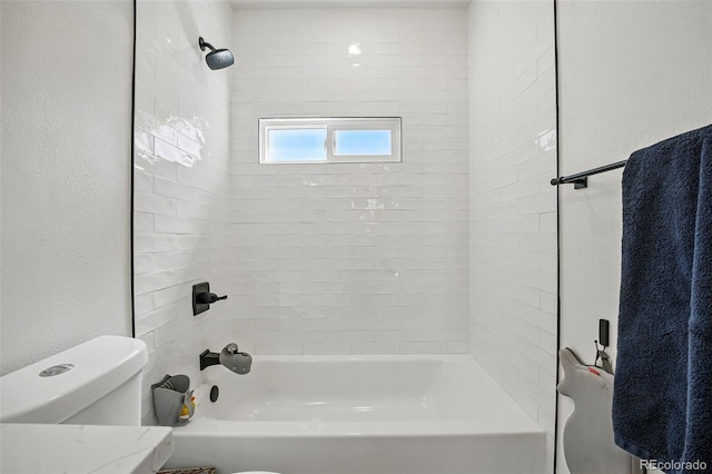 bathroom with shower / tub combination and toilet