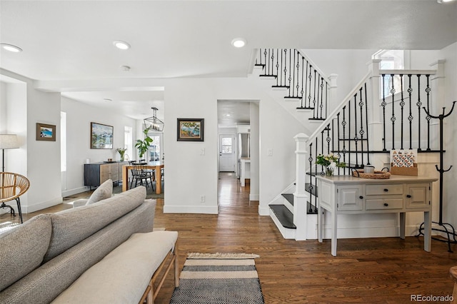 living area with baseboards, recessed lighting, stairs, and dark wood-style floors