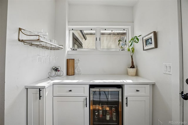 bar featuring a bar and beverage cooler