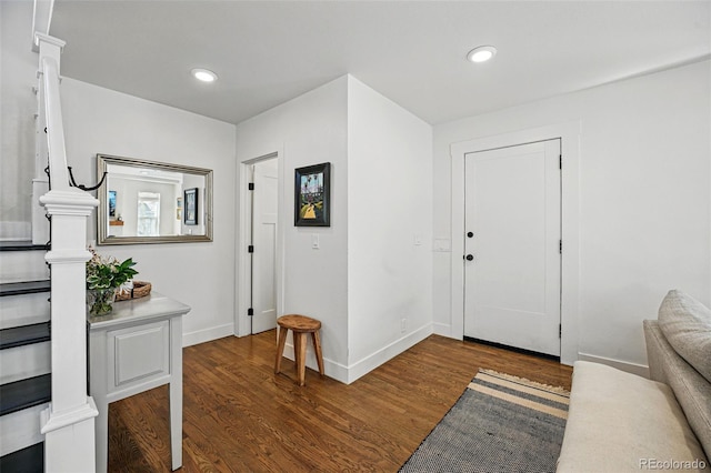 foyer entrance featuring baseboards, recessed lighting, and wood finished floors