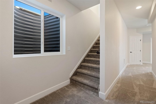 staircase featuring carpet floors, recessed lighting, and baseboards