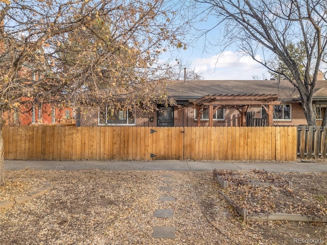 view of front of home with a pergola