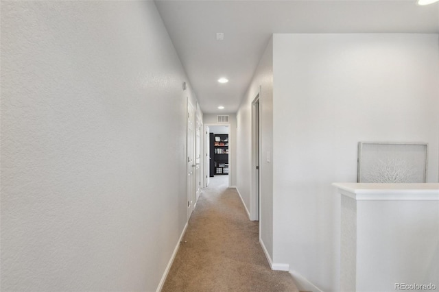 19221 E 65th Ave, Denver, CO 80249 - hall featuring carpet flooring, recessed lighting, and an upstairs landing