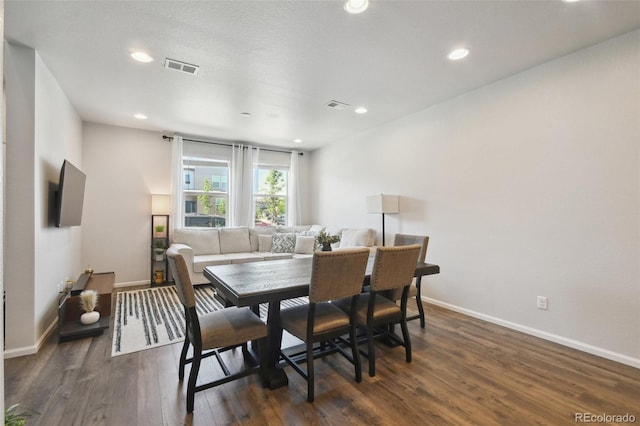 19221 E 65th Ave, Denver, CO 80249 - dining space featuring dark wood-style floors and recessed lighting