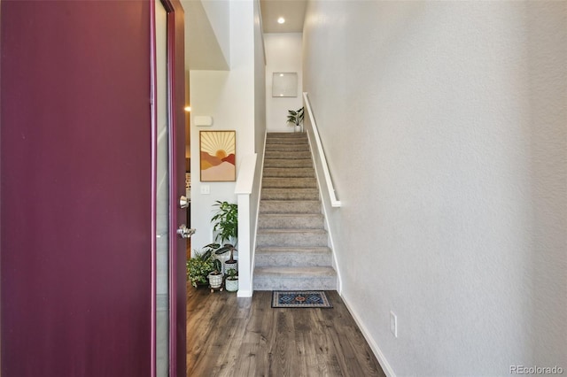 19221 E 65th Ave, Denver, CO 80249 - stairway featuring wood finished floors and baseboards