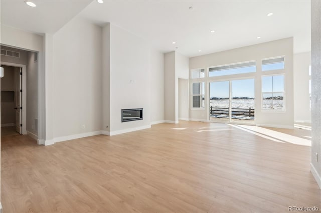 unfurnished living room featuring light hardwood / wood-style flooring