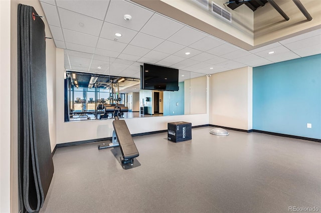 exercise room with a paneled ceiling