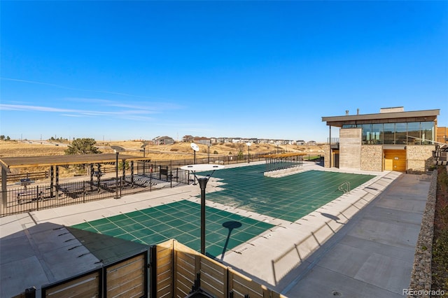 view of swimming pool with a patio area