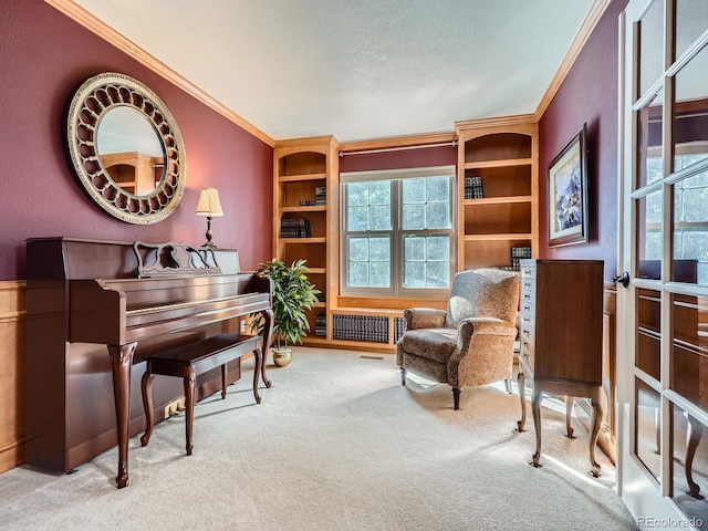 6577 S Waco Way, Aurora, CO 80016 - sitting room with ornamental molding, carpet, radiator heating unit, and built in shelves