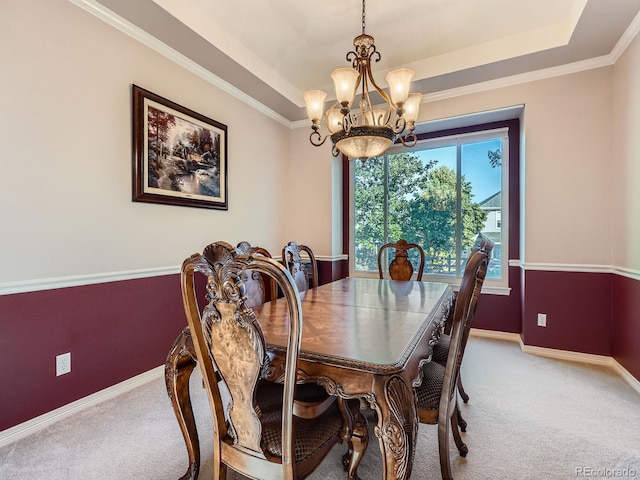6577 S Waco Way, Aurora, CO 80016 - dining room featuring carpet flooring, a chandelier, a tray ceiling, and ornamental molding