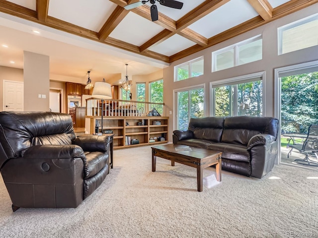 6577 S Waco Way, Aurora, CO 80016 - living area featuring light carpet, a chandelier, beam ceiling, coffered ceiling, and ceiling fan