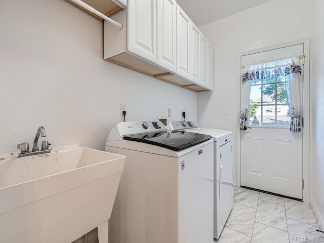 6577 S Waco Way, Aurora, CO 80016 - laundry room with independent washer and dryer, light marble finish flooring, and cabinet space