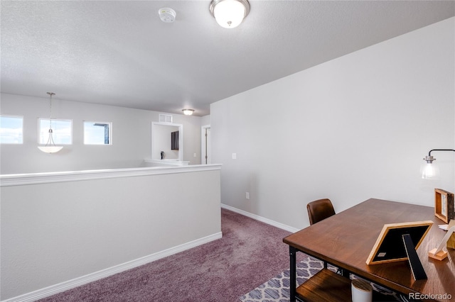 office with carpet floors, visible vents, baseboards, and a textured ceiling