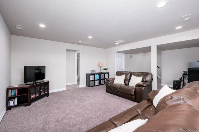 carpeted living room featuring recessed lighting, visible vents, and baseboards