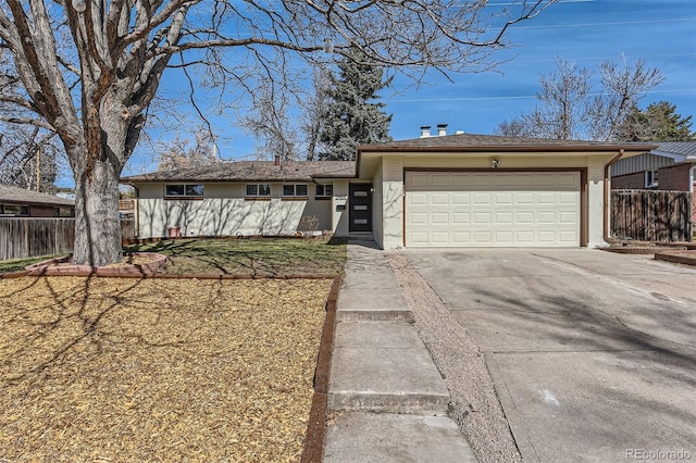 ranch-style home featuring fence, a garage, and driveway