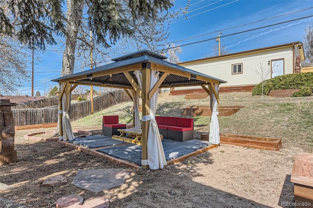 view of yard featuring a gazebo, a patio area, and fence