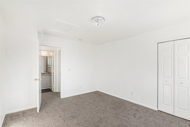 unfurnished bedroom featuring carpet and a closet