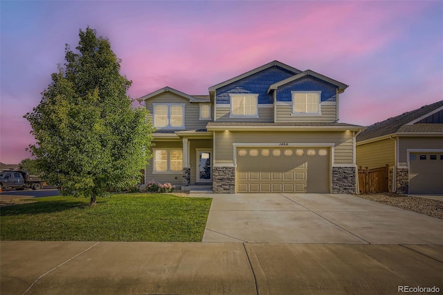 1464 Moraine Valley Dr, Severance, CO 80550 - craftsman-style house with concrete driveway, stone siding, and a garage
