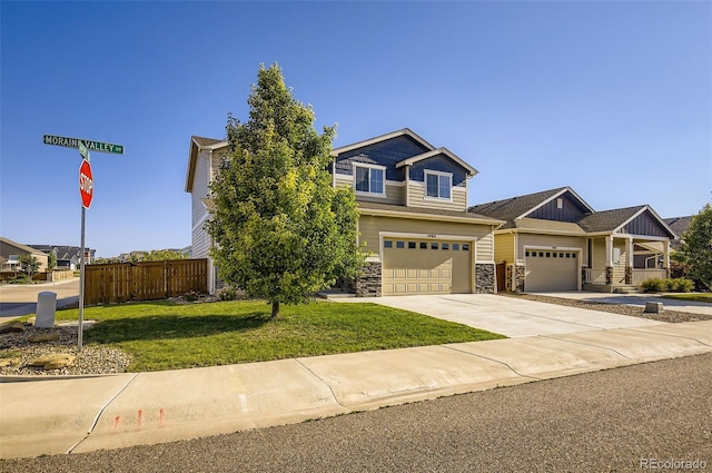 1464 Moraine Valley Dr, Severance, CO 80550 - view of front of property featuring stone siding, concrete driveway, and a garage