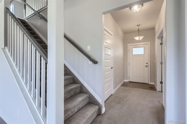 1464 Moraine Valley Dr, Severance, CO 80550 - foyer featuring carpet floors and stairs